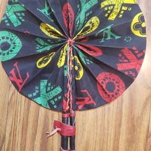 African Ankara Print Folding Fan . Made With Leather Handles .